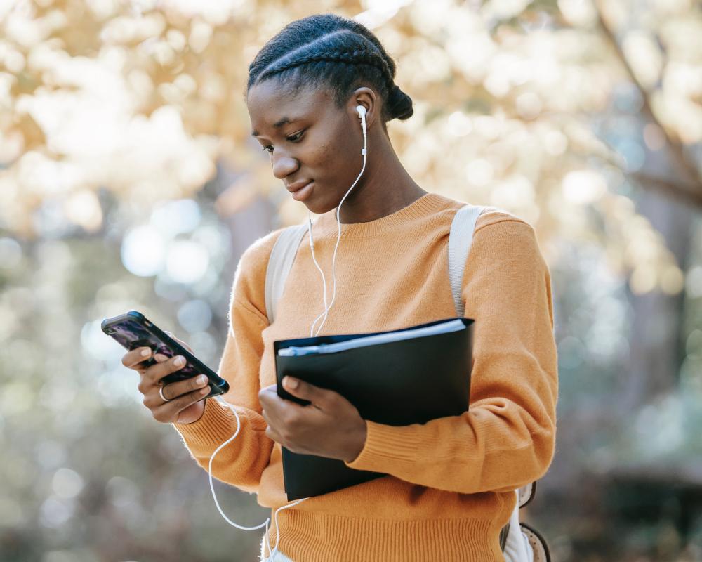 Get the best bulk SMS solutions with mNotify: Woman using our service to communicate